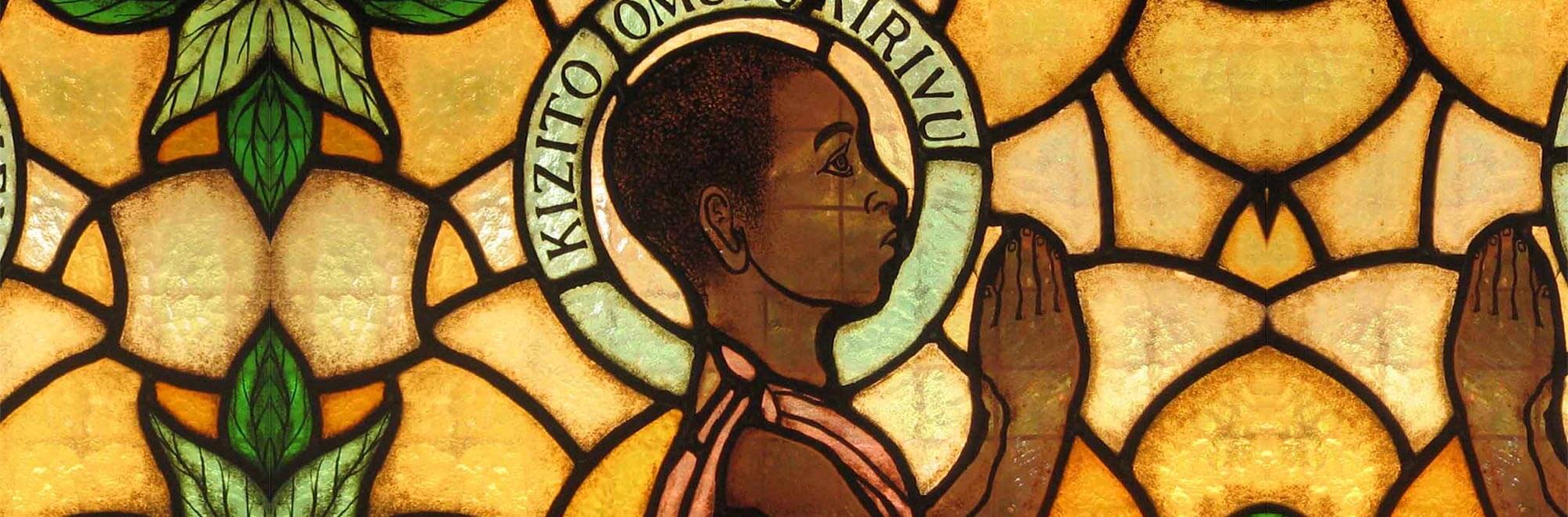 st. kizito portrait in a stained glass window